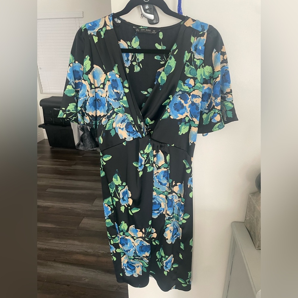 New dress without tags. Size large but on the smaller side. Knee length.